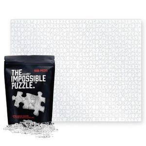 May include: A black bag with the text "The Clearly Impossible Puzzle" and a picture of a puzzle with 1000 pieces. The bag is sitting in front of a white 1000 piece puzzle.