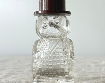 Frasco de perfume de cristal con figura de bulldog vintage, transparente, marrón, con sombrero de copa en miniatura.