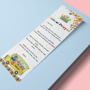May include: A colorful bookmark with a school bus illustration and a prayer for a new school year. The prayer reads: "Dear God, As I begin this new school year, guide me with Your wisdom and love. Help me to be brave and kind, to learn with an open heart and mind. Bless my teachers, friends, and all I meet. May our days be filled with joy and peace. Watch over us in all we do, and keep us safe in Your care, too. Amen."