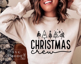 May include: A white sweatshirt with a black graphic of Christmas trees and the text "Christmas Crew".