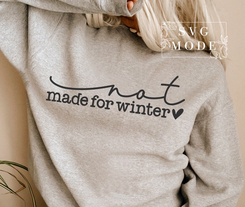 May include: Grey sweatshirt with the text "not made for winter" and a small heart.