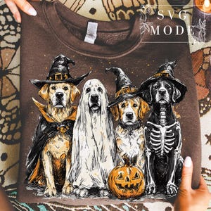 May include: Brown sweatshirt featuring a Halloween-themed graphic of four dogs dressed in costumes. One dog is a ghost, another wears a skeleton costume, and the others are in witch costumes. A carved pumpkin is in front of one dog.