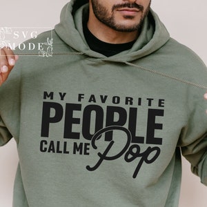 May include: A green hooded sweatshirt with black text that reads "My Favorite People Call Me Pop".
