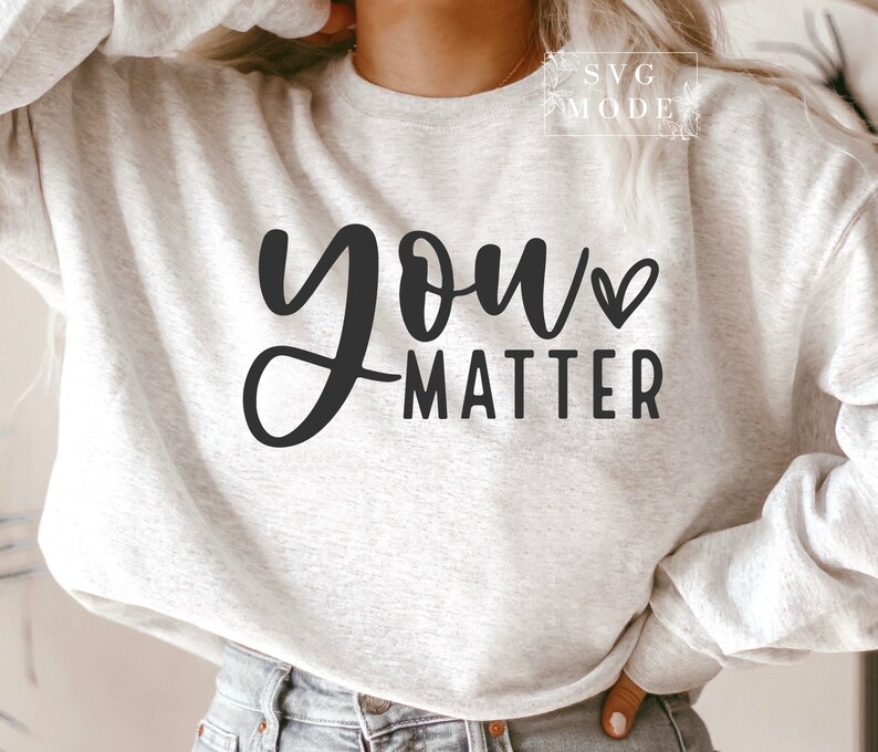 May include: A gray sweatshirt with the text "you matter" in black lettering with a small heart symbol.