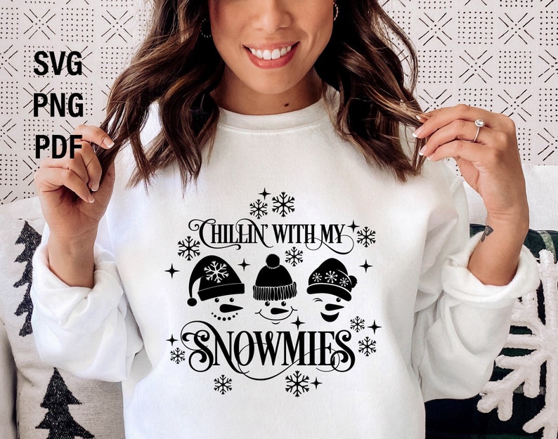 May include: White sweatshirt with a black graphic design featuring three snowmen and the text "Chillin' with my snowmies".