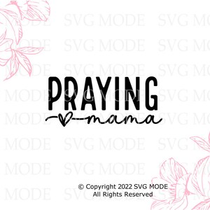 May include: Black and white graphic design with the text "Praying Mama" with a small heart in between the words. The graphic is surrounded by pink floral designs.