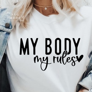 Puede incluir: Camiseta blanca con texto negro que dice "MY BODY my rules" con un pequeño símbolo de corazón.