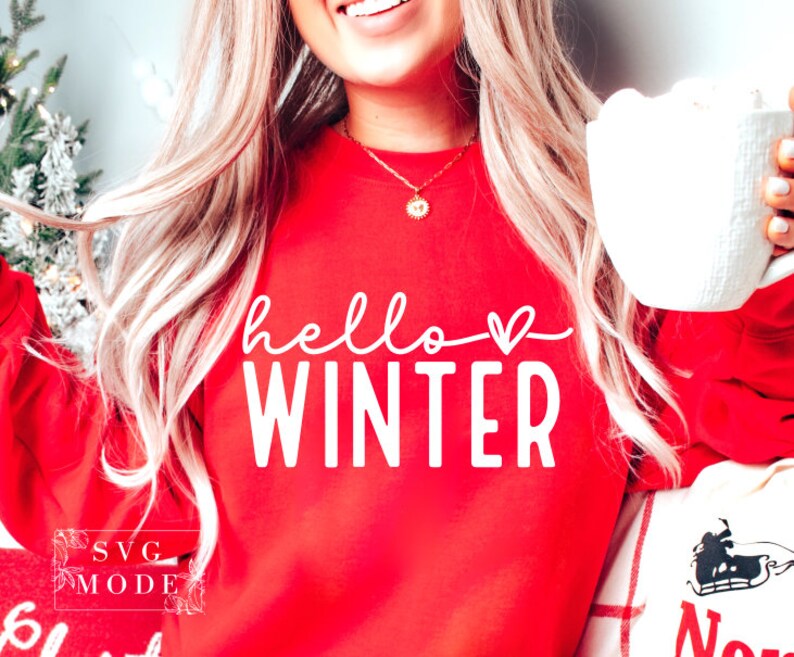 May include: A red sweatshirt with the text "hello winter" in white with a small heart after the word "hello".