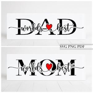 May include: Two white signs with black text that reads "World's Best Dad" and "World's Best Mom" with a red heart in the middle of each sign.