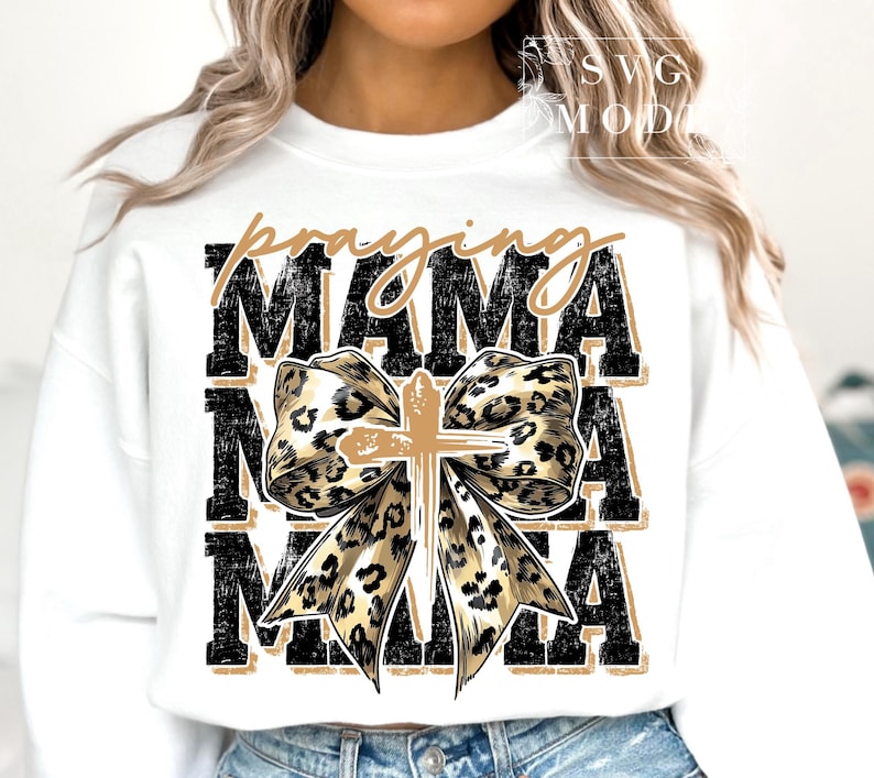 Faith-inspired MAMA digital PNG featuring bold varsity lettering, leopard print bow, and a central cross, perfect for religious mom shirts.