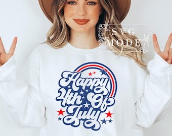 May include: White sweatshirt with a blue and red circle graphic that says "Happy 4th of July" in a retro font. There are stars around the circle.