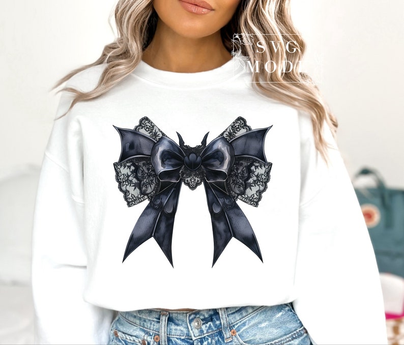 May include: A white sweatshirt with a black and white lace bow with a black center. The bow has a gothic style.
