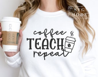 May include: White sweatshirt with black text that reads "coffee teach repeat" and a black and white illustration of a coffee cup with steam coming from it.