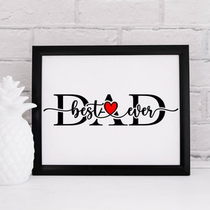 May include: Black and white framed print with the text "DAD best ever" in a cursive font. A red heart is incorporated into the "A" of DAD.