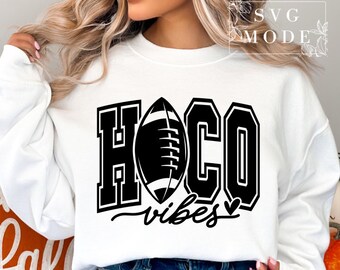 May include: White sweatshirt with black text that reads "HOCO vibes" and a black and white football graphic.