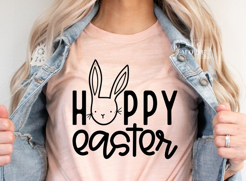 May include: A pink t-shirt with a black bunny rabbit graphic and the text "Happy Easter" in black.