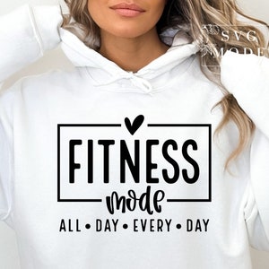 May include: White hoodie with black text that reads "Fitness mode all day every day" with a small heart above the word "Fitness".