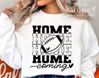 May include: White sweatshirt with black text that reads "HOME HOME HOME COMING" with a black and white football graphic in the center.