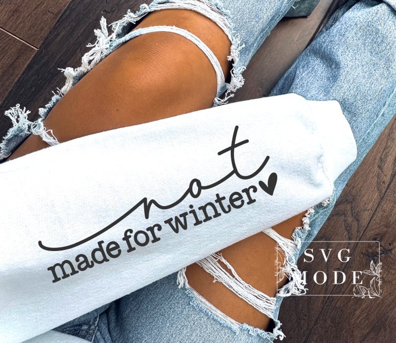May include: A white sweatshirt with the text "not made for winter" and a small heart.