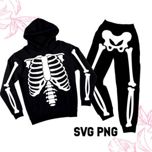 May include: Black hoodie and trousers with a white skeleton design. The hoodie has a drawstring hood and the trousers have a relaxed fit.