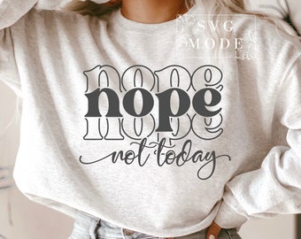 May include: A gray sweatshirt with the text "nope not today" in black lettering. The text is in a retro font style.