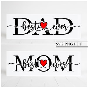 May include: Two white signs with black text that reads "DAD best ever" and "MOM best ever" with a red heart in the middle of each sign. The signs are on a white wood background.