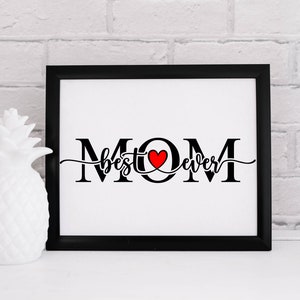 May include: Black and white framed print with the text "MOM best ever" in a cursive font with a red heart in the middle of the word "MOM".