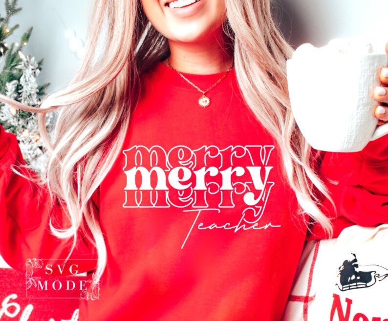 May include: Red sweatshirt with white text that reads "merry merry teacher" in a retro font.