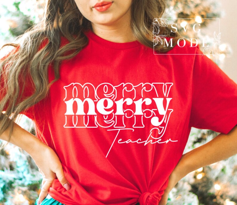 May include: Red t-shirt with white text that reads "merry merry teacher" in a retro font.