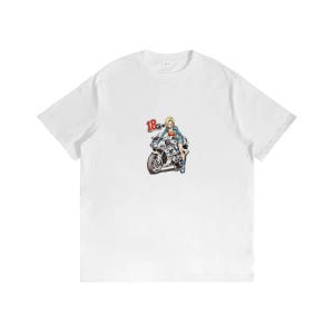 May include: A white short-sleeve t-shirt featuring a graphic print in the center. The graphic depicts a blonde character in a denim jacket sitting on a white and blue sport motorcycle, with the red number 18 printed next to the character.