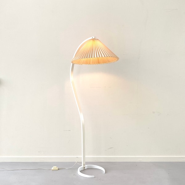 A white Danish Caprani floor lamp