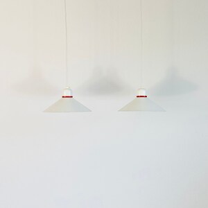 A set of white pendant lights by Horn Denmark