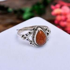 Red 2025 goldstone ring