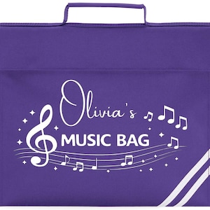 May include: A purple music bag featuring a white treble clef, musical notes, and the text "Olivia's MUSIC BAG." The bag has a handle and a flap closure. White stripes are on the lower right corner.