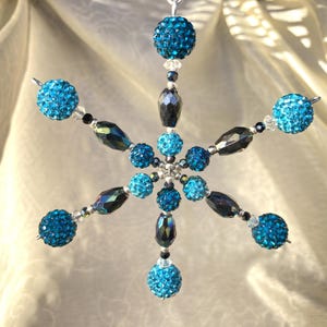 Snowflake Christmas ornament Beautiful turquoise raspberry beads, silver, crystal, and black accents