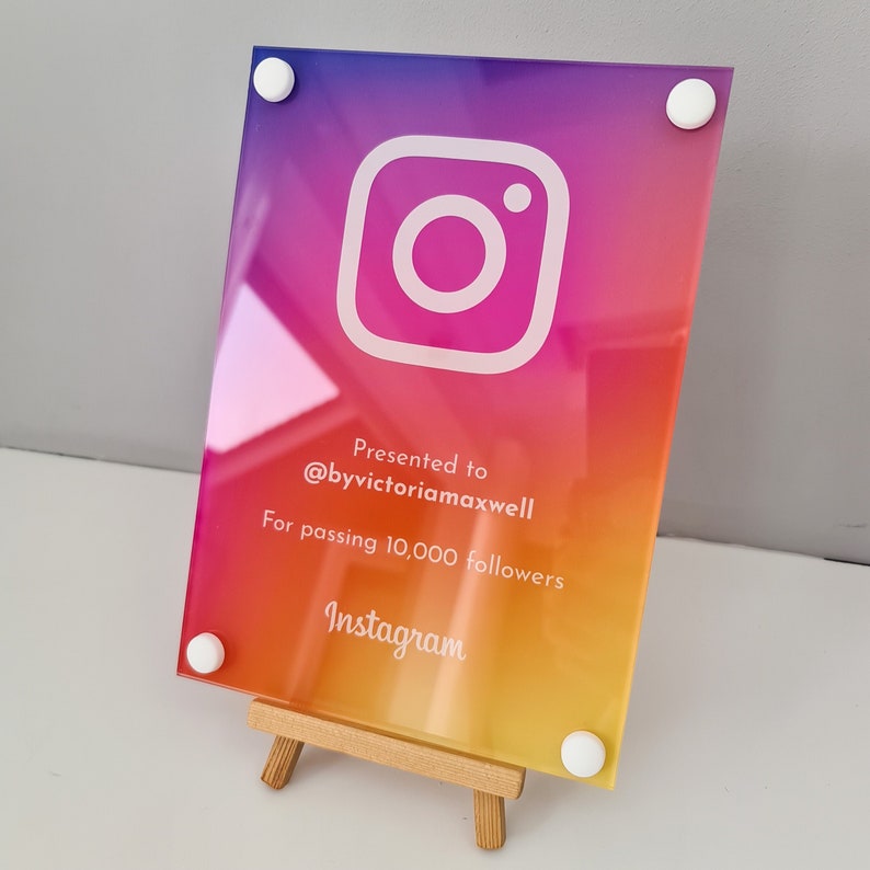 May include: A colorful acrylic plaque with the Instagram logo, the text "Presented to @byvictoriamaxwell For passing 10,000 followers Instagram" and white accents.