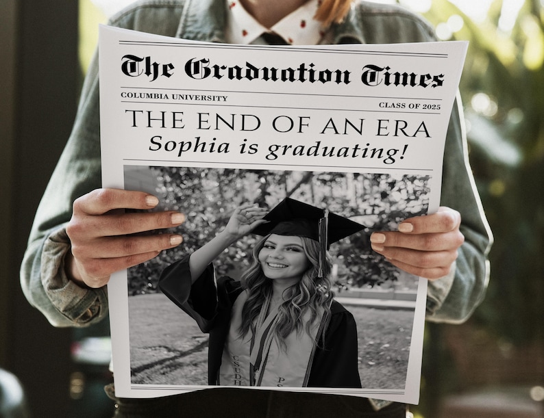 May include: A newspaper titled "The Graduation Times" with the headline "THE END OF AN ERA Sophia is graduating!" A black and white photo of a graduate in a cap and gown is featured. The newspaper is held by a person.