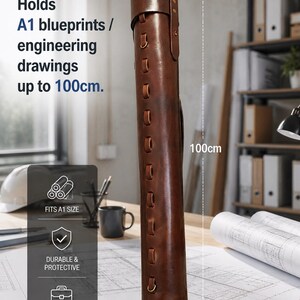 May include: A brown leather blueprint tube, approximately 100cm tall, designed to hold A1 size drawings. The tube features decorative stitching and metal accents. Text on the image reads: "Holds A1 blueprints / engineering drawings up to 100cm."