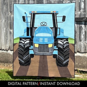 May include: A blue tractor quilt with a detailed design. The quilt features a large tractor in the center, set against a light blue sky and brown field. The text "DIGITAL PATTERN/INSTANT DOWNLOAD" is at the bottom.