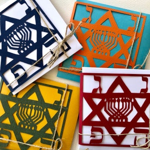CHANOEKA (6), Verzameling van vier (rood, blauw, groen, oranje) wenskaarten met envelop