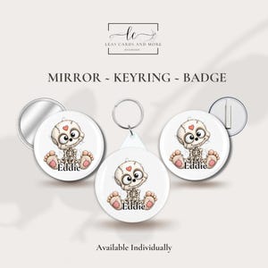 May include: A round pocket mirror, a circular keyring, and a round pin badge, each featuring a cartoon skeleton character with a small red heart on its forehead and the name Eddie printed below in black text on a white background.
