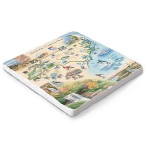 May include: Square ceramic tile featuring a detailed map of North Carolina with illustrations of landmarks, wildlife, and the coastline. The tile has a white border and the words "North Carolina" are printed at the top.