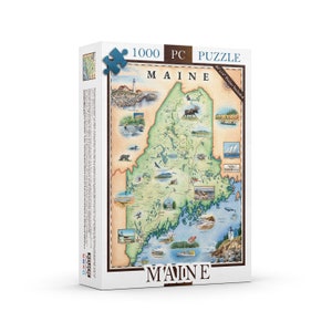 May include: A 1000 piece jigsaw puzzle depicting a detailed map of Maine, featuring various landmarks and wildlife illustrations. The puzzle box is white with blue and brown accents. The text "1000 PC PUZZLE MAINE 20" x 16" Poster Included" is printed on the box.