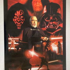 May include: A red and black poster with the text "Duel of the Sith" and images of characters from the Star Wars movie franchise. The characters include Darth Vader, Darth Sidious, and Count Dooku.