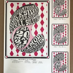 May include: A vintage concert poster advertising a performance by Quicksilver Messenger Service at the Fillmore Auditorium in San Francisco on May 20 and 21, 1969. The poster features a psychedelic design with a swirling, abstract image of the band's name and the date of the concert. The poster also includes information about ticket outlets and free posters for attendees.