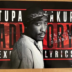 May include: A black and red poster with the text "TUPAC SHAKUR ALL EYEZ ON ME LYRICS" and a black and white photo of Tupac Shakur.