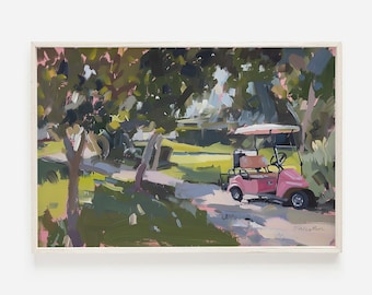 May include: An impressionistic painting of a golf cart on a path. The golf cart is pink with a white canopy. The background features green trees and a light-colored path. The artwork is framed in a white wooden frame.