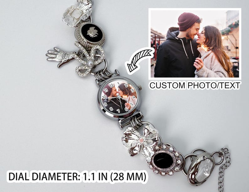 May include: A silver-toned watch with a custom photo on the dial, surrounded by decorative charms. The watch features a dial diameter of 1.1 inches (28 mm) and includes the text "CUSTOM PHOTO/TEXT". The watch is adorned with various embellishments.