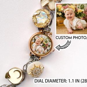 May include: A rose gold watch with a custom photo on the face, surrounded by decorative links. The watch face is 1.1 inches (28 mm) in diameter. The watch features a photo of a baby and the text "CUSTOM PHOTO/TEXT".