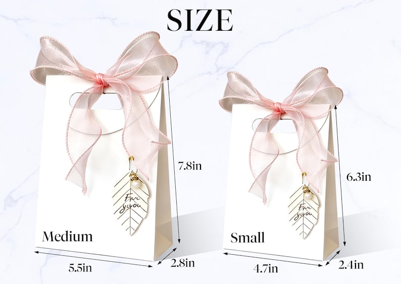 May include: Two white gift bags, one medium and one small, each adorned with a sheer pink ribbon bow. The medium bag is 7.8 inches tall, 5.5 inches wide, and 2.8 inches deep. The small bag is 6.3 inches tall, 4.7 inches wide, and 2.4 inches deep. Each bag has a gold leaf charm.